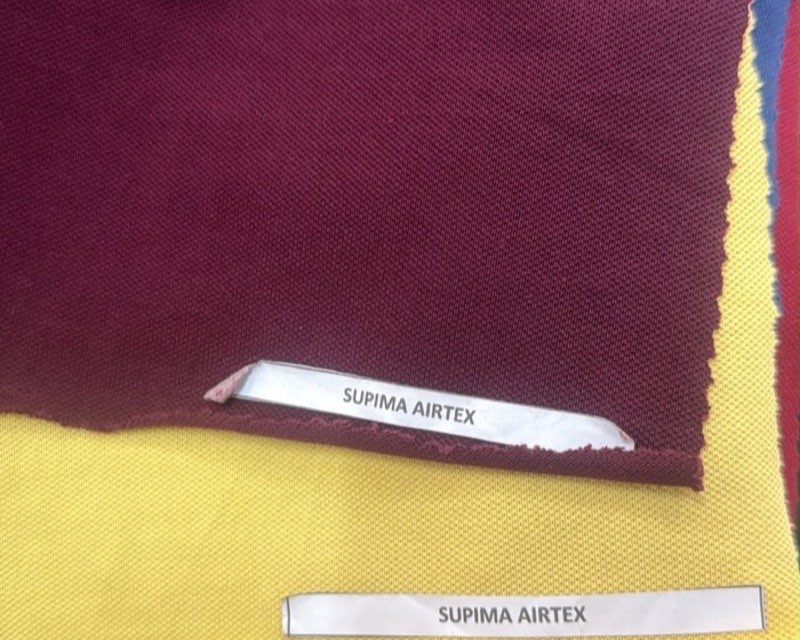 Supima cotton airtex (pique) knit fabric swatches in maroon and yellow